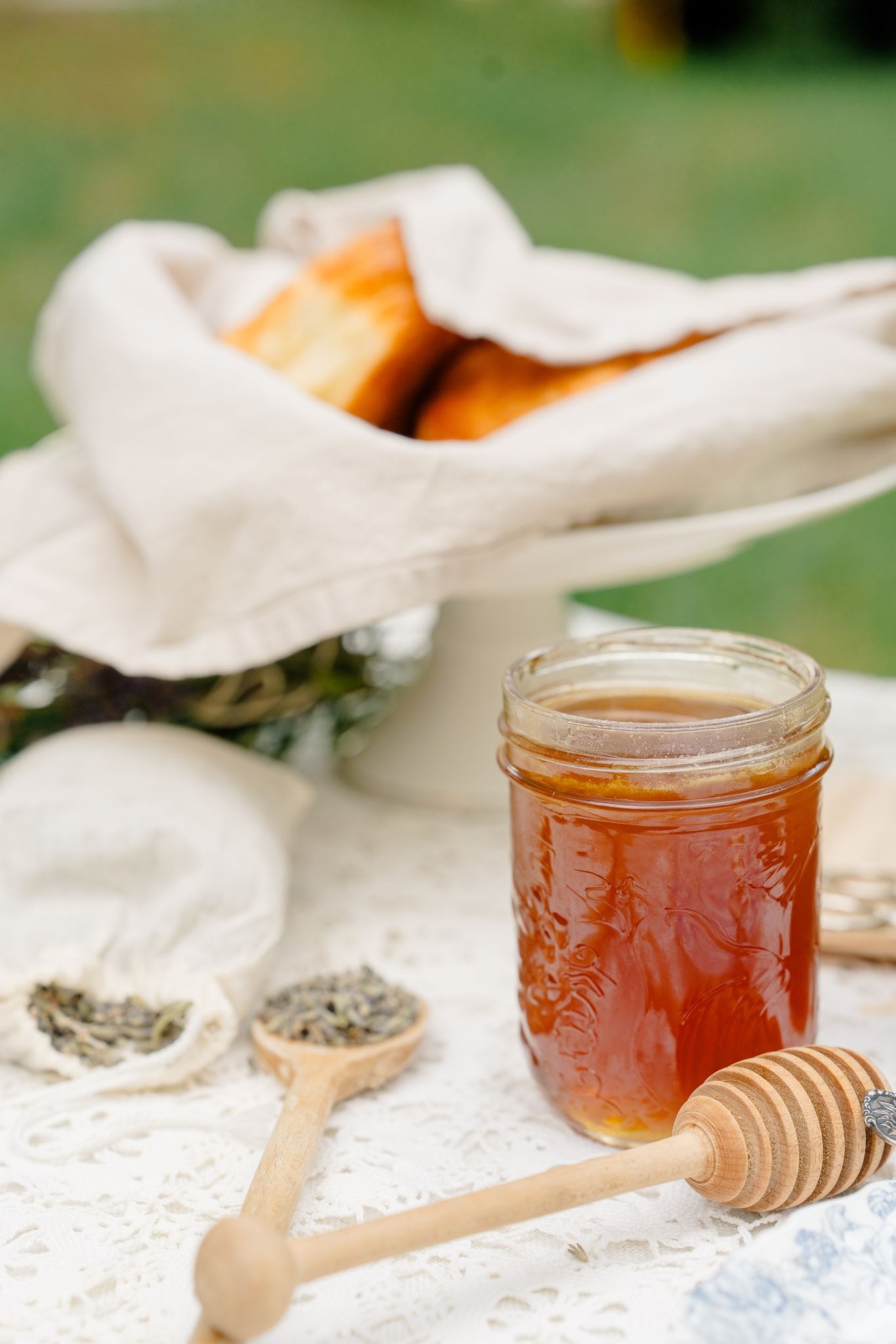 Honey jar and dipper on a rustic table